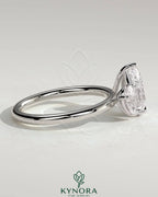 Kynora CJ 0.5ct and 1.25ct pear-shaped Toi et Moi engagement ring with claw settings and intricate band design.