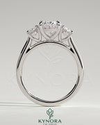 Kynora CJ 2ct oval claw trilogy engagement ring with oval side stones, showcasing elegant three-stone diamond design.
