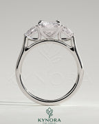 Kynora CJ 2ct radiant claw trilogy engagement ring with pear side stones and cathedral setting, showcasing elegant diamond craftsmanship.