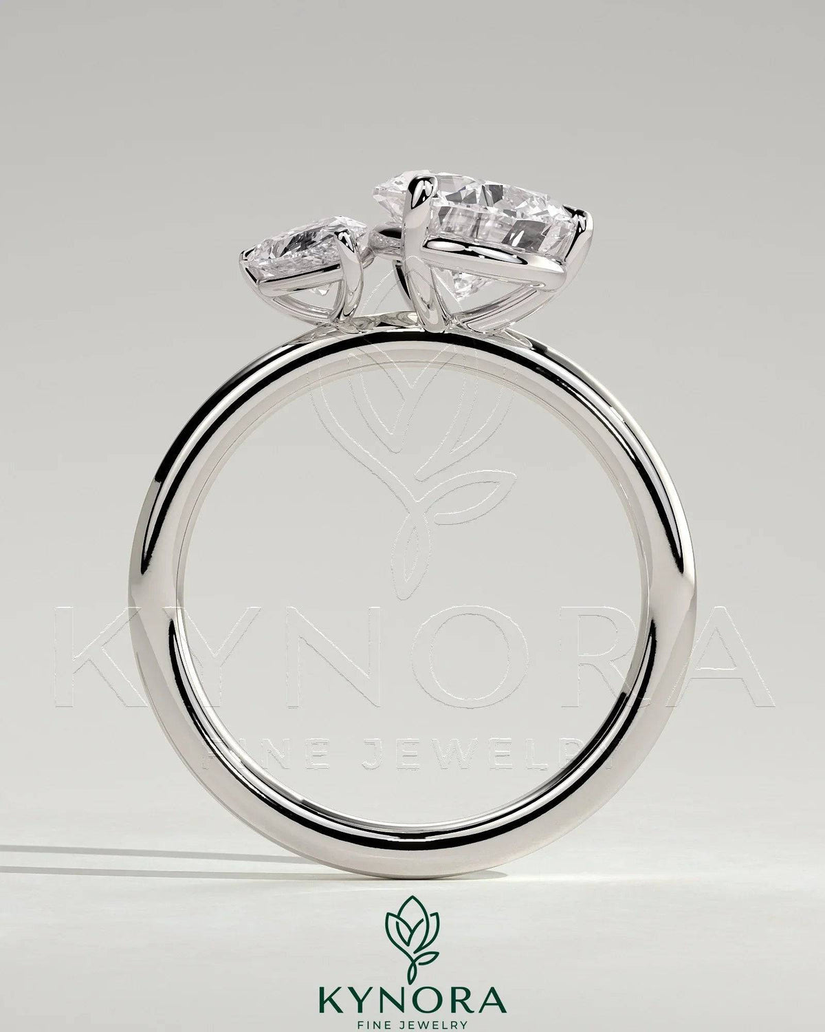 Kynora CJ 0.5ct pear-shaped diamond and 1.25ct pear-shaped diamond Toi et Moi engagement ring with claw settings.
