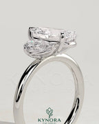 Kynora CJ 0.5ct and 1.25ct pear-shaped Toi et Moi engagement ring with claw setting, elegant and sparkling jewelry design