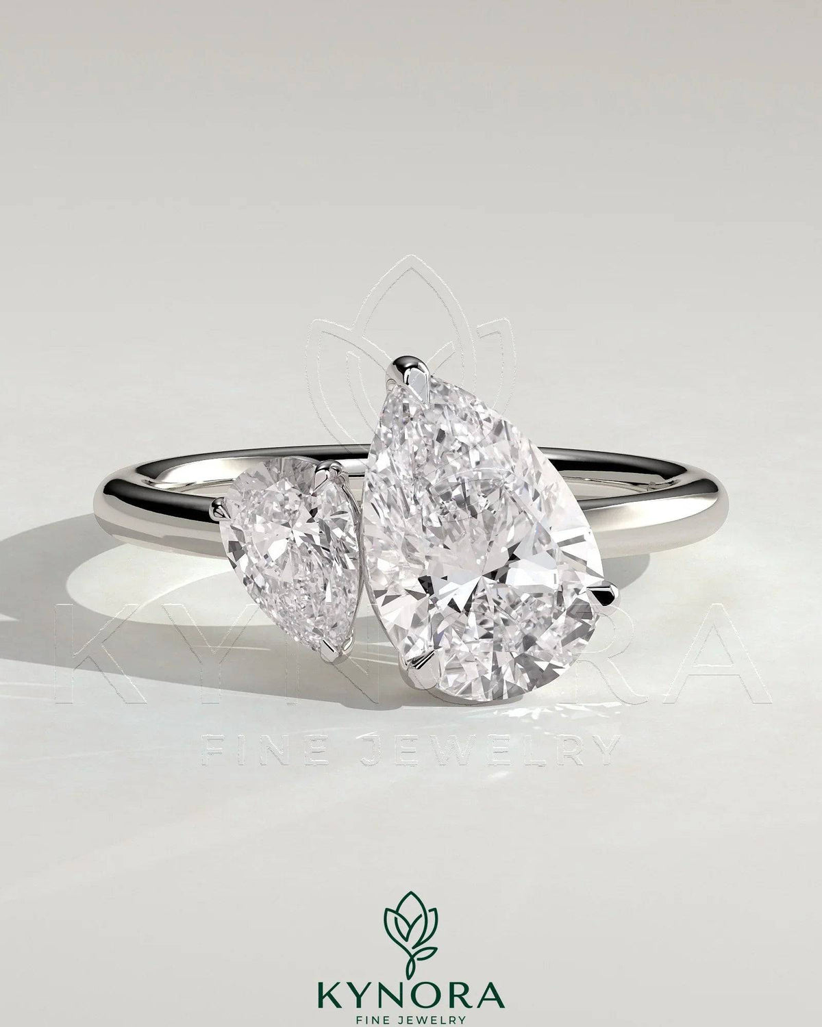 Kynora CJ 0.5ct pear-shaped diamond and 1.25ct pear-shaped diamond Toi et Moi engagement ring with claw settings.