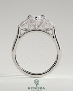 Kynora CJ 2ct marquise claw trilogy engagement ring with pear side stones and cathedral setting showcasing sparkling diamonds.