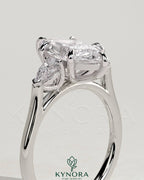 Kynora CJ 2ct marquise claw trilogy engagement ring with pear side stones and cathedral setting, showcasing elegant diamond design.
