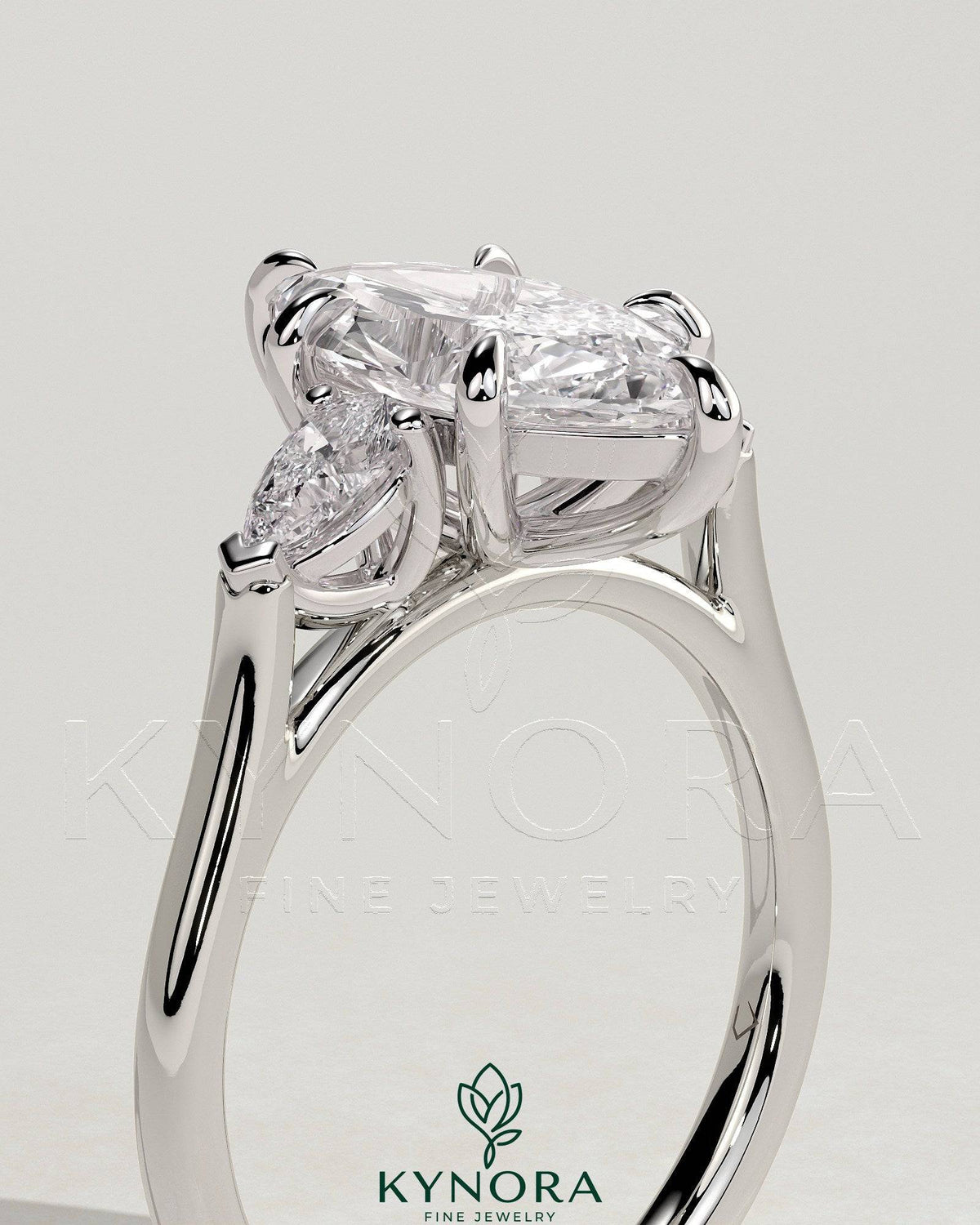 Kynora CJ 2ct marquise claw trilogy engagement ring with pear side stones and cathedral setting, showcasing elegant diamond design.
