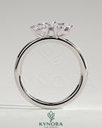 Kynora CJ 1.5ct pear and 1.5ct oval diamond Toi et Moi engagement ring with claw settings, elegant and sparkling in silver setting.