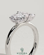 Kynora CJ Toi et Moi engagement ring featuring 1.5ct pear-shaped and 1.5ct oval diamonds set in a claw setting.