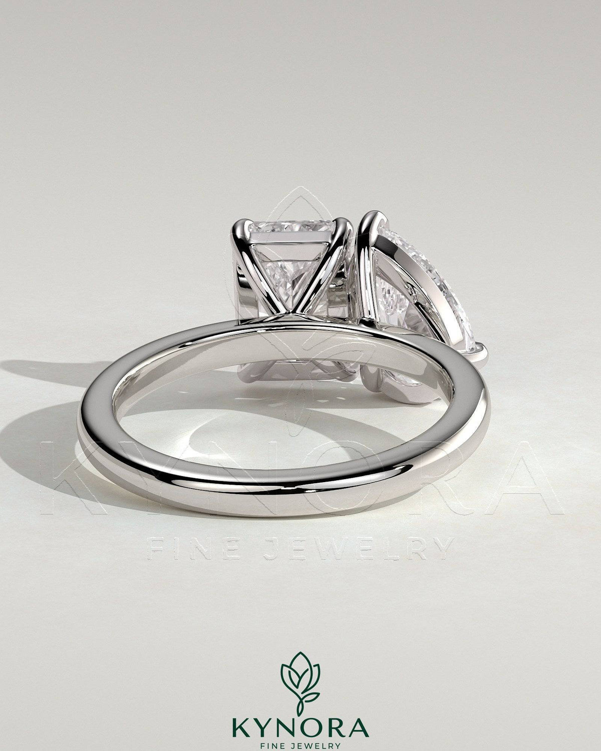 Kynora CJ Toi et Moi engagement ring with 1.5ct pear-shaped and 1.8ct radiant diamonds in a claw setting.