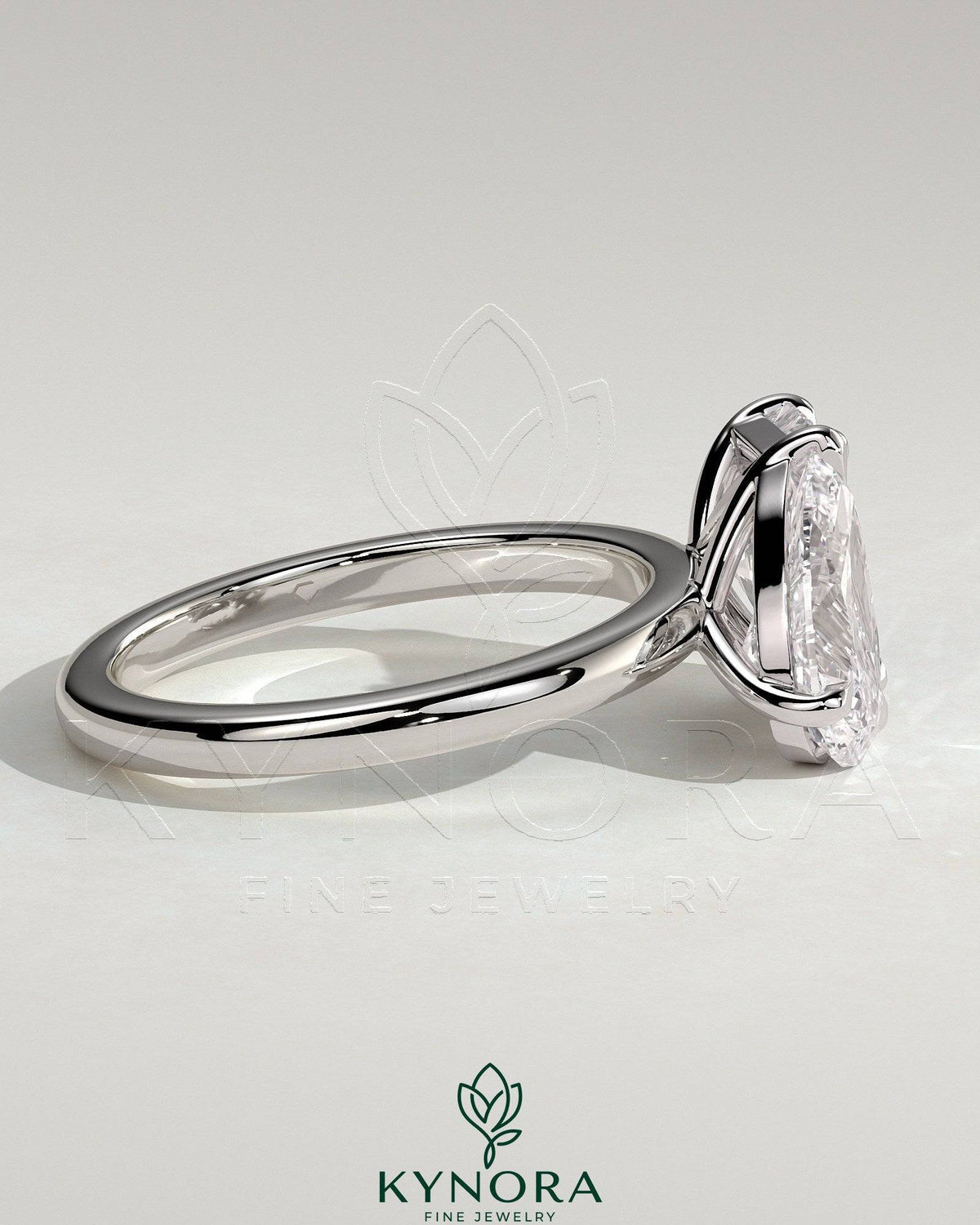 Kynora CJ Toi et Moi engagement ring featuring a 1.5ct pear-shaped diamond and a 1.8ct radiant diamond in a claw setting.
