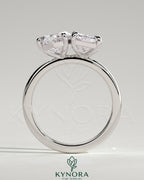 Kynora CJ Toi et Moi engagement ring with 1.5ct pear-shaped and 1.8ct radiant diamonds in a claw setting.