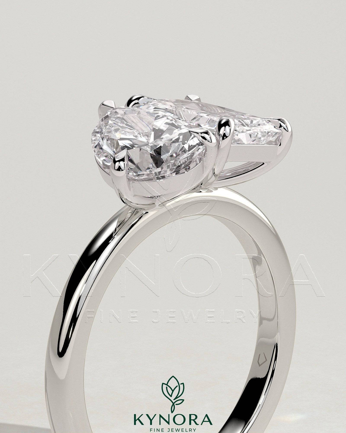 Kynora CJ Toi et Moi engagement ring featuring a 1.5ct pear-shaped and 1.8ct radiant-cut diamonds in a claw setting.