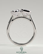 Kynora CJ 3.3ct pear-shaped and 3.3ct emerald-cut Toi et Moi engagement ring with bezel settings, detailed and elegant design