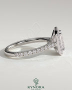 Kynora CJ 2ct emerald claw solitaire engagement ring with halo, pave band, and cathedral high setting showcasing sparkling jewelry.