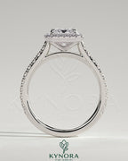 Kynora CJ 2ct emerald claw solitaire engagement ring with halo, pave band, and cathedral high setting.