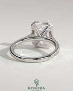 Kynora CJ 2ct radiant diamond claw solitaire engagement ring with halo, pave band, and cathedral high setting.