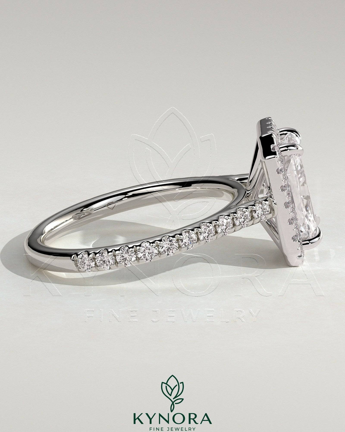 Kynora CJ 2ct radiant claw solitaire halo engagement ring with pave band and cathedral high setting, showcasing sparkling diamond details