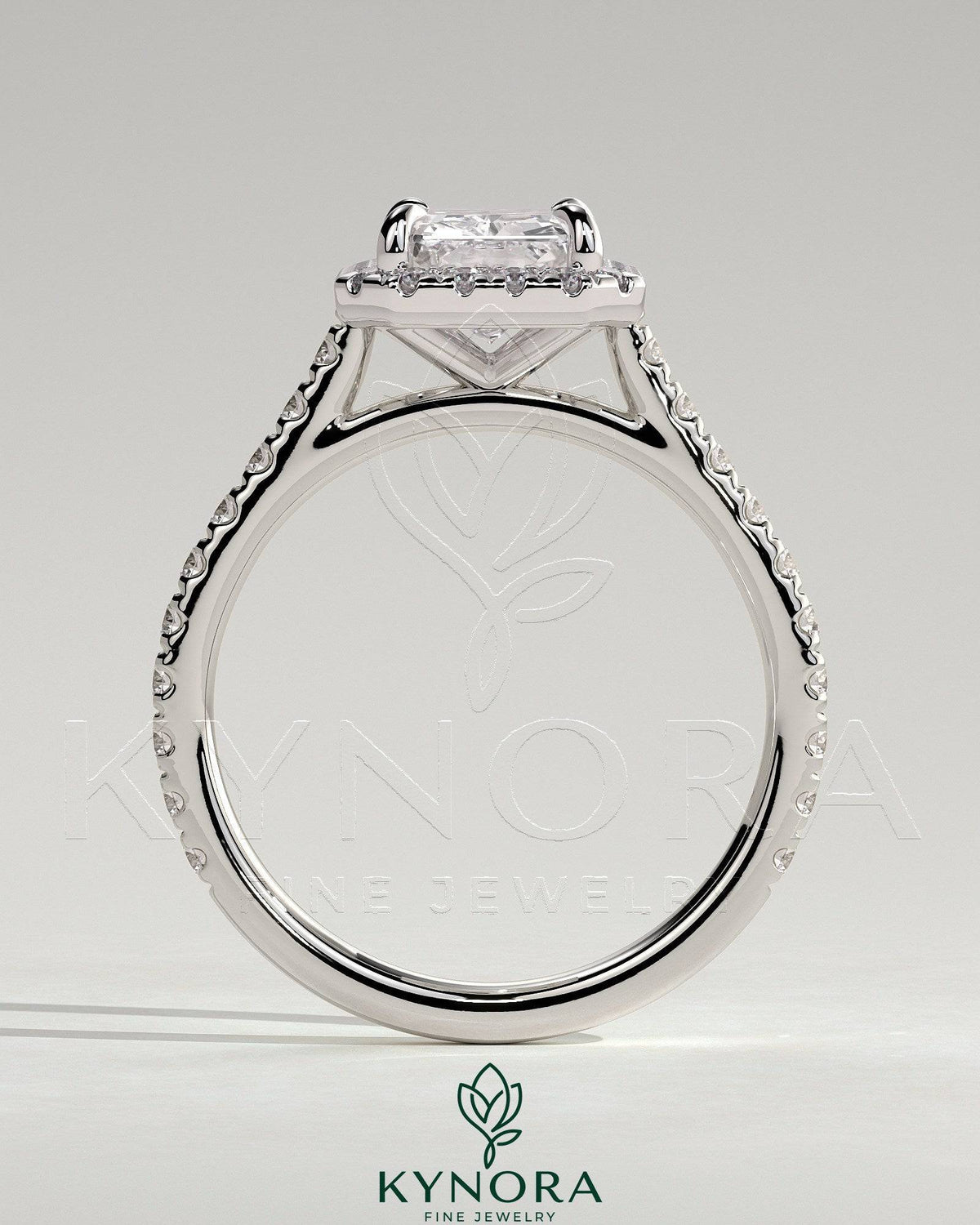 Kynora CJ 2ct radiant claw solitaire engagement ring with halo, pave band, and cathedral high setting, showcasing intricate diamond details.