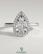 Kynora CJ 2ct pear-shaped diamond solitaire halo engagement ring with cathedral high setting, elegant and sparkling jewelry piece.