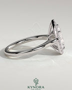 Kynora CJ 2ct pear-shaped diamond halo solitaire engagement ring with cathedral high setting and intricate band details.