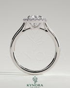 Kynora CJ 2ct pear-shaped diamond solitaire engagement ring with halo and cathedral high setting, showcasing intricate design details.