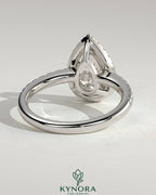 Kynora CJ 2ct pear-shaped diamond solitaire halo engagement ring with pave band and low setting, fine jewelry design