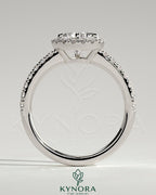 Kynora CJ 2ct pear-shaped solitaire engagement ring with pave band, halo accents, and low setting in elegant jewelry design.