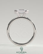 Kynora CJ 2ct emerald cut East-West bezel solitaire engagement ring showcasing a central emerald gemstone on a sleek band.