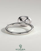 Kynora CJ 2ct oval east-west bezel solitaire engagement ring featuring a central gemstone and sleek band design.