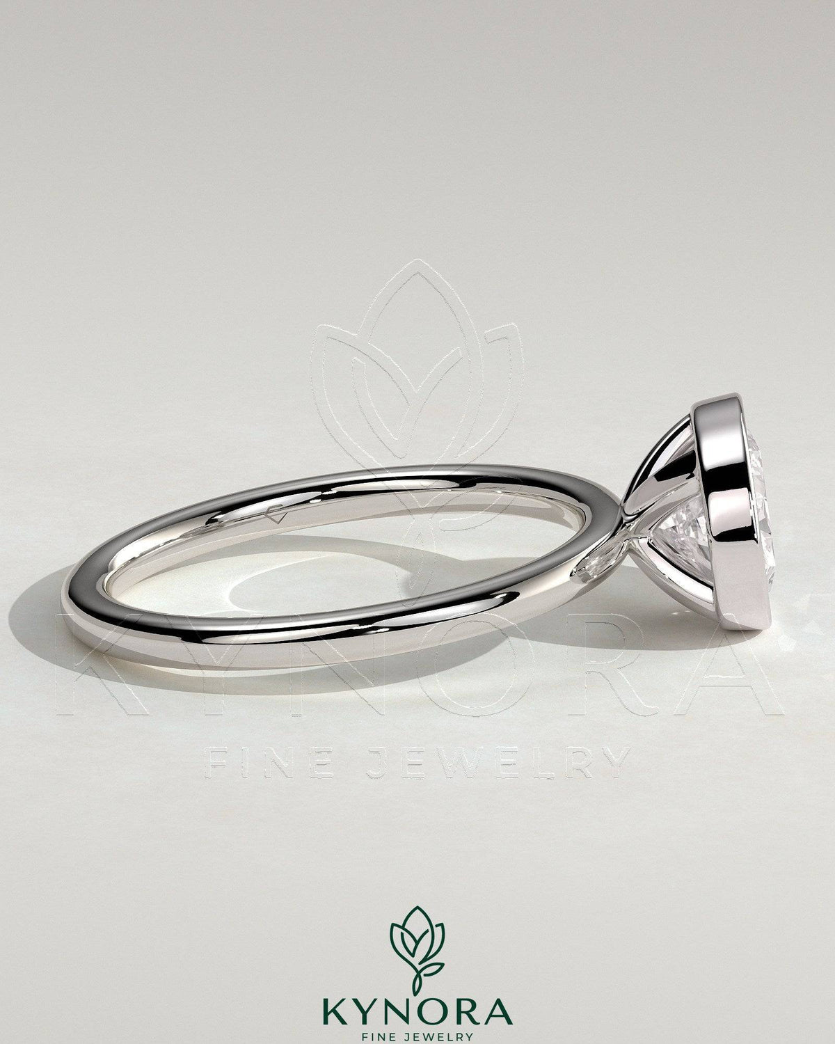 Kynora CJ 2ct oval east-west bezel solitaire engagement ring with a prominent center diamond and sleek band design.