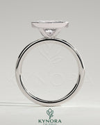 Kynora CJ 2ct oval east-west bezel solitaire engagement ring with a central diamond set horizontally in a sleek band.