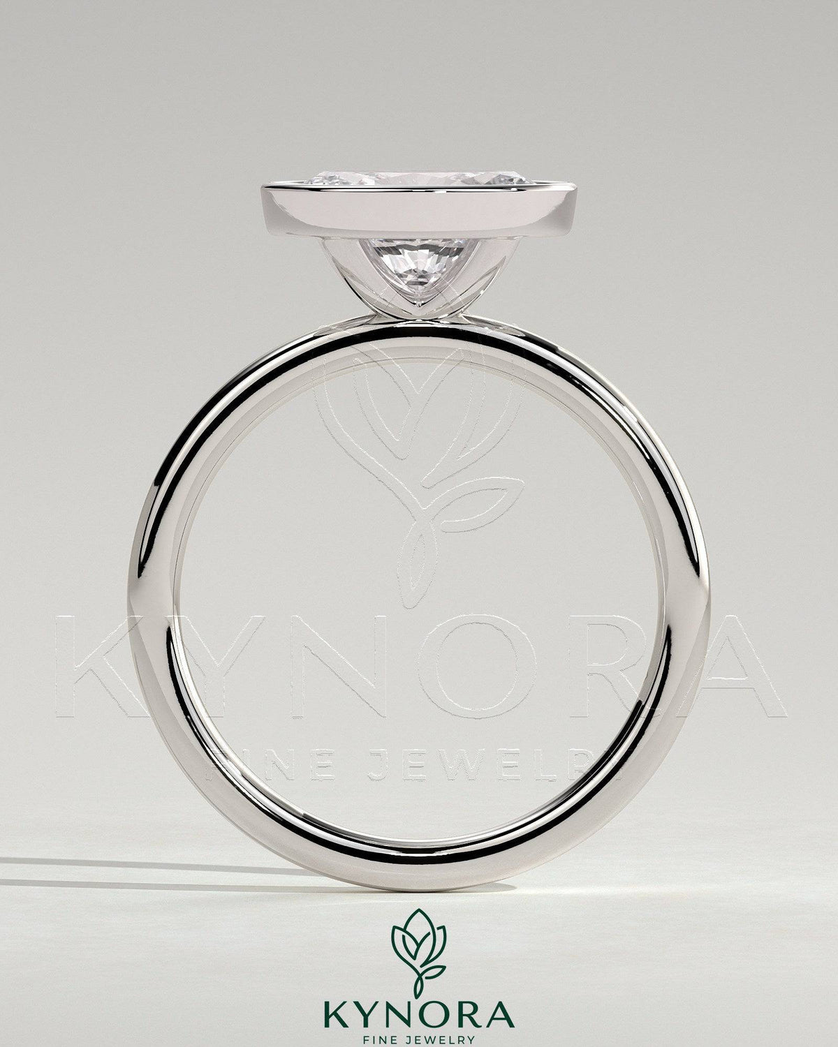 Kynora CJ 2ct oval east-west bezel solitaire engagement ring with a central diamond set horizontally in a sleek band.