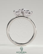 Kynora CJ 1.8ct emerald and 1.5ct pear-shaped diamond Toi et Moi engagement ring with hidden halo, sterling silver setting