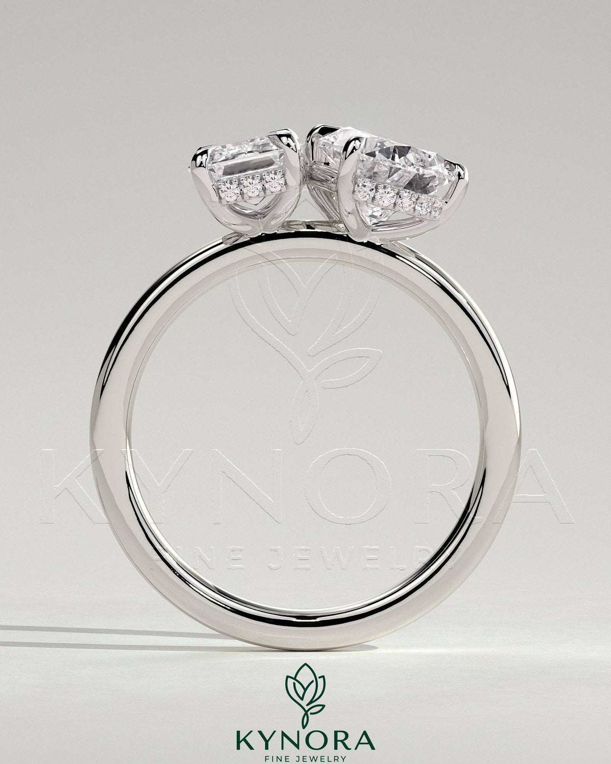 Kynora CJ 1.8ct emerald and 1.5ct pear-shaped diamond Toi et Moi engagement ring with hidden halo, sterling silver setting