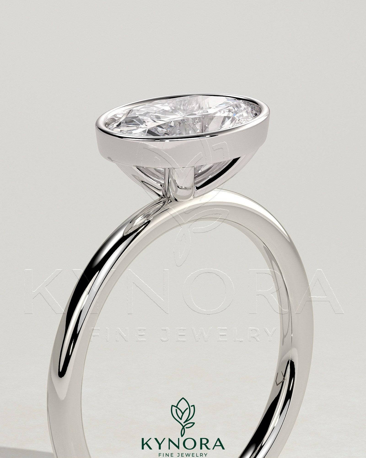 Kynora CJ 2ct oval East-West bezel solitaire engagement ring with a central diamond set horizontally in a sleek band.