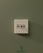 Kynora CJ 2ct emerald east-west claw solitaire engagement ring with spaced double band in silver or white gold.