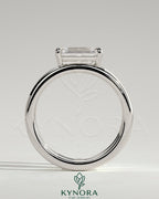 Kynora CJ 2ct emerald east-west claw solitaire engagement ring with a spaced double band design, showcasing a stunning emerald gemstone.