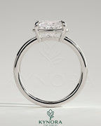 Kynora CJ 2ct elongated East-West cushion claw solitaire engagement ring with bezel frame, showcasing elegant diamond setting.