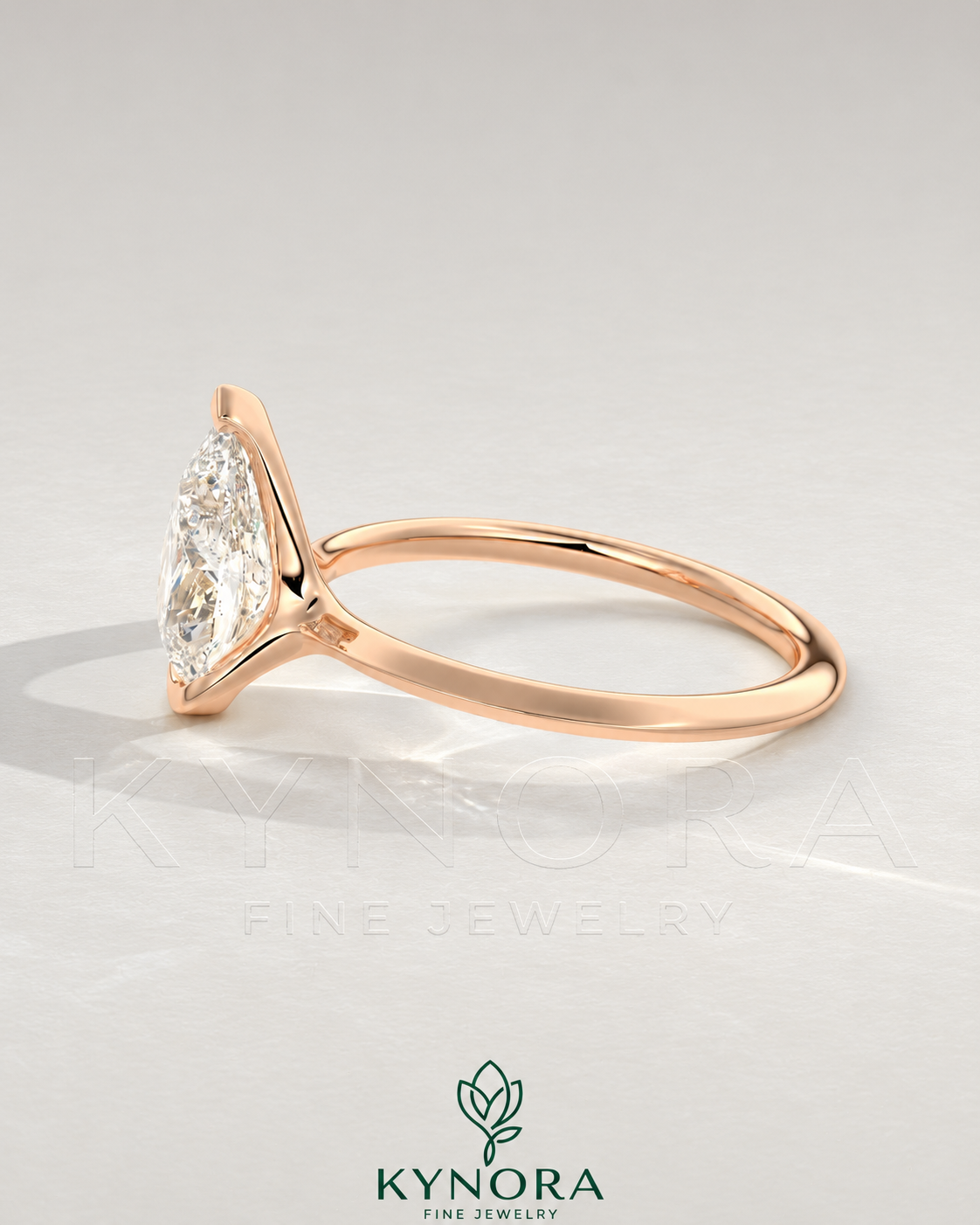 Pear cut moissanite half-bezel engagement ring in 925 silver with botanical ivory background, showcasing elegant jewelry design.