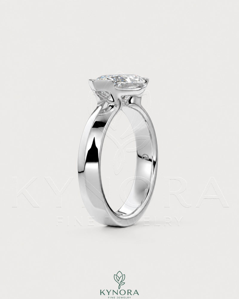 East-West Marquise Moissanite solitaire ring in sterling silver featuring a prominent marquise-cut stone.