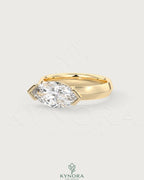 East-West marquise moissanite solitaire ring in sterling silver by Kynora CJ, showcasing a sparkling marquise-shaped stone in a sleek design.