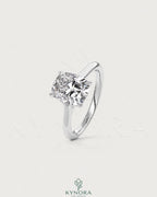 Cushion cut moissanite solitaire engagement ring in 925 sterling silver with a sleek, polished band and sparkling center stone.