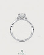 Sterling silver solitaire engagement ring with cushion cut moissanite gemstone, elegant and sparkling jewelry by Kynora CJ.