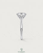 Cushion cut moissanite solitaire engagement ring in 925 sterling silver with a sparkling center stone and elegant band.