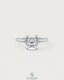 Sterling silver solitaire engagement ring with cushion cut moissanite gemstone, featuring a sleek and elegant design by Kynora CJ.