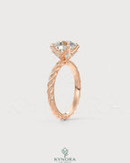 Round Moissanite solitaire engagement ring with twisted shank in 925 silver, showcasing elegant craftsmanship and sparkling center stone.