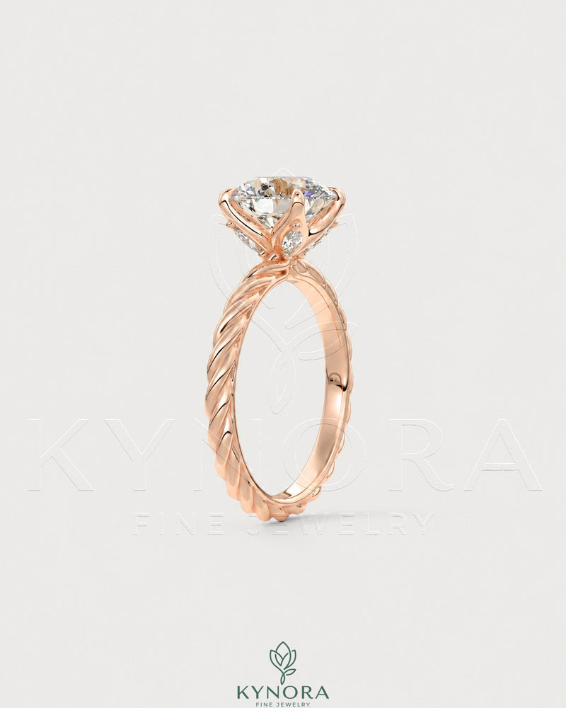 Round Moissanite solitaire engagement ring with twisted shank in 925 silver, showcasing elegant craftsmanship and sparkling center stone.