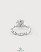Round moissanite solitaire engagement ring with twisted shank in 925 silver, featuring a sparkling central stone and intricate band design.