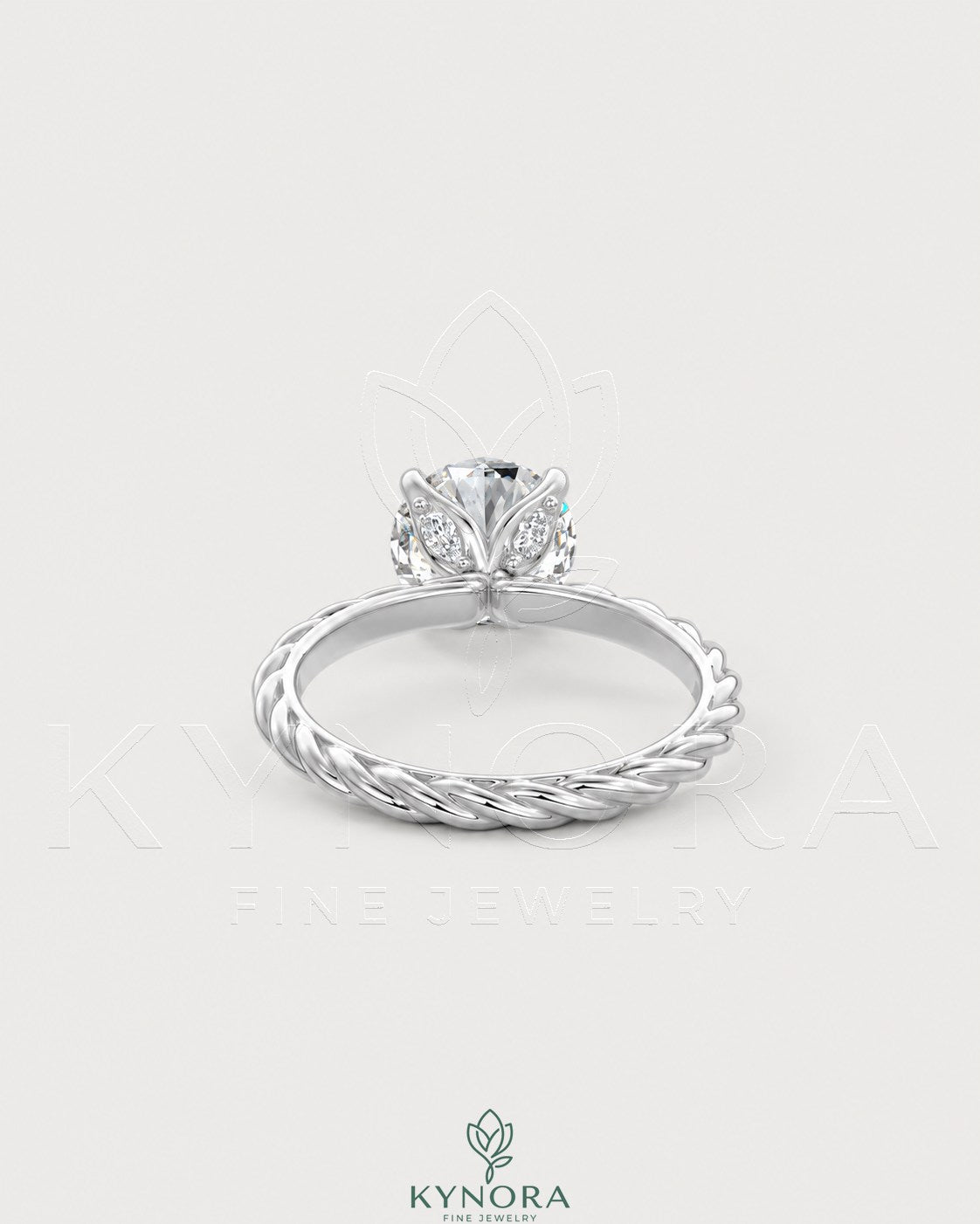 Round moissanite solitaire engagement ring with twisted shank in 925 silver, featuring a sparkling central stone and intricate band design.
