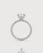 Round moissanite solitaire engagement ring with twisted silver shank, featuring a polished 925 silver finish, by Kynora CJ.