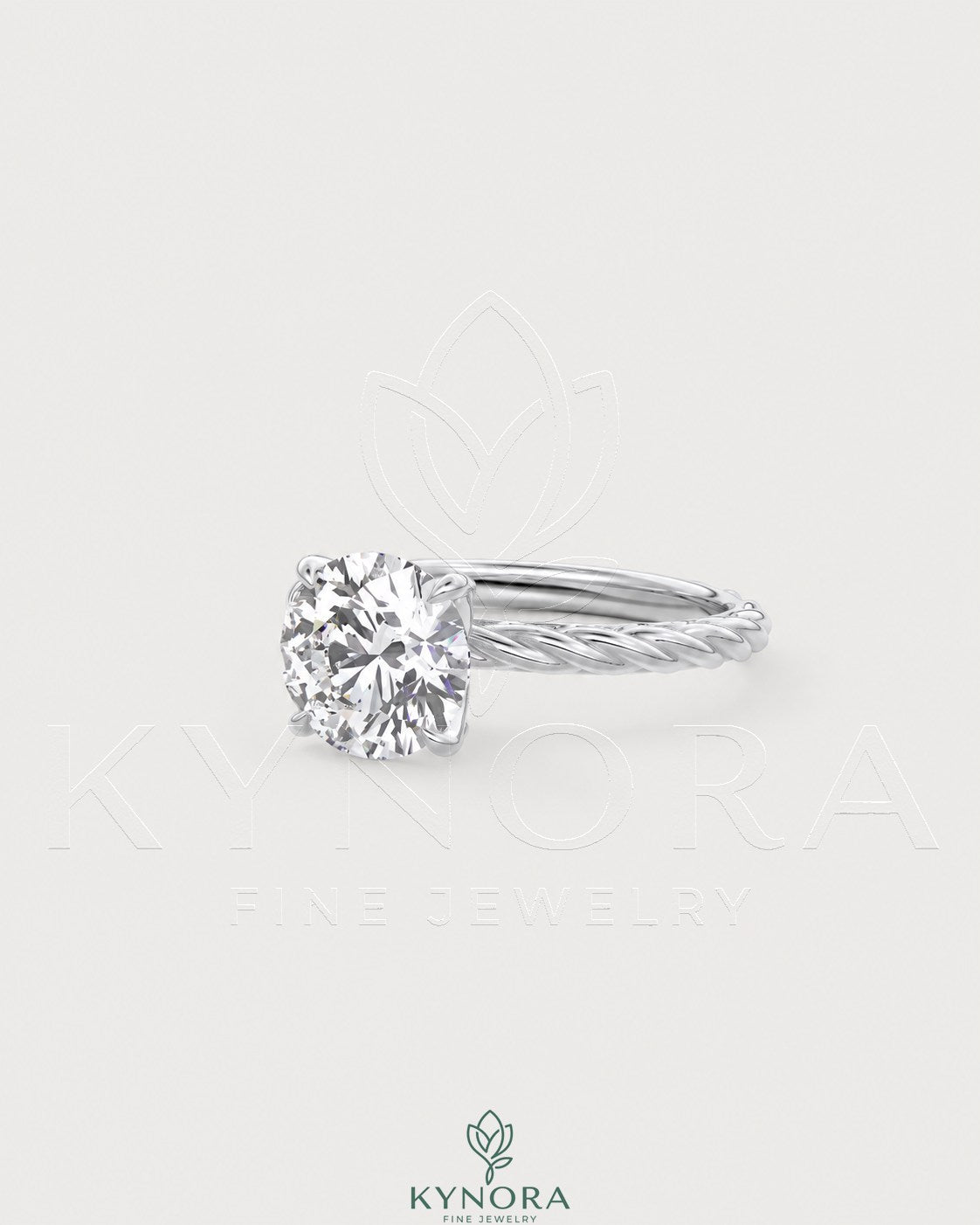 Round moissanite solitaire engagement ring with twisted silver shank by Kynora CJ, showcasing a sparkling center stone and intricate band design.
